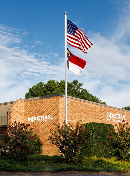 Industrial Automation Co. headquarters with the US and North Carolina flags